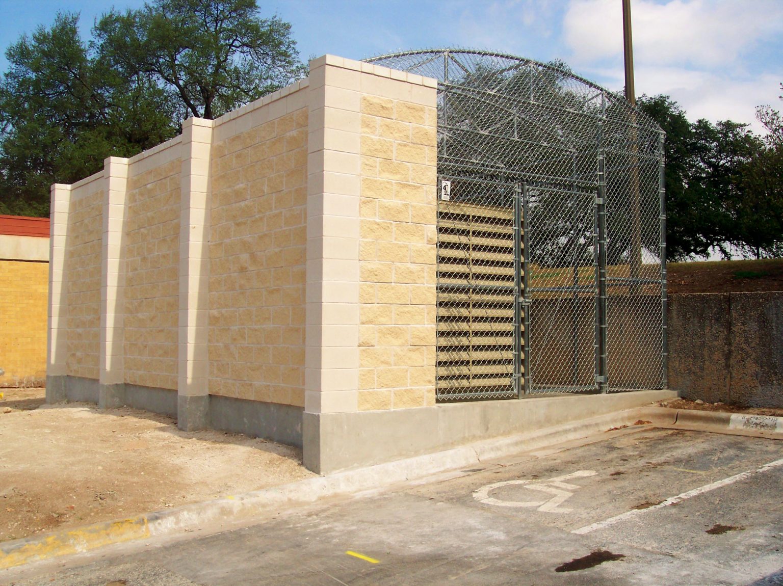 Chain Link Enclosure with Brick Wall - Viking Fence